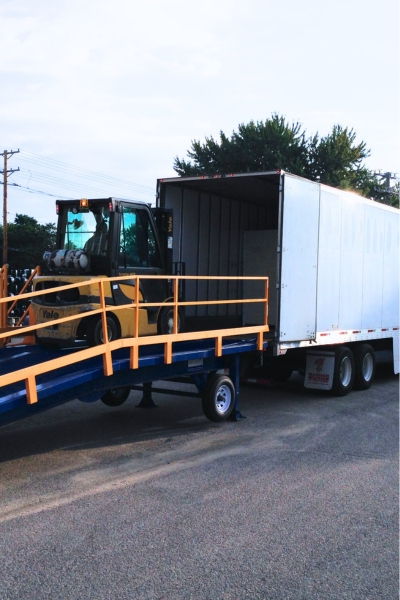Forklift loading ramp used to load pallet freight in and out of a container truck
